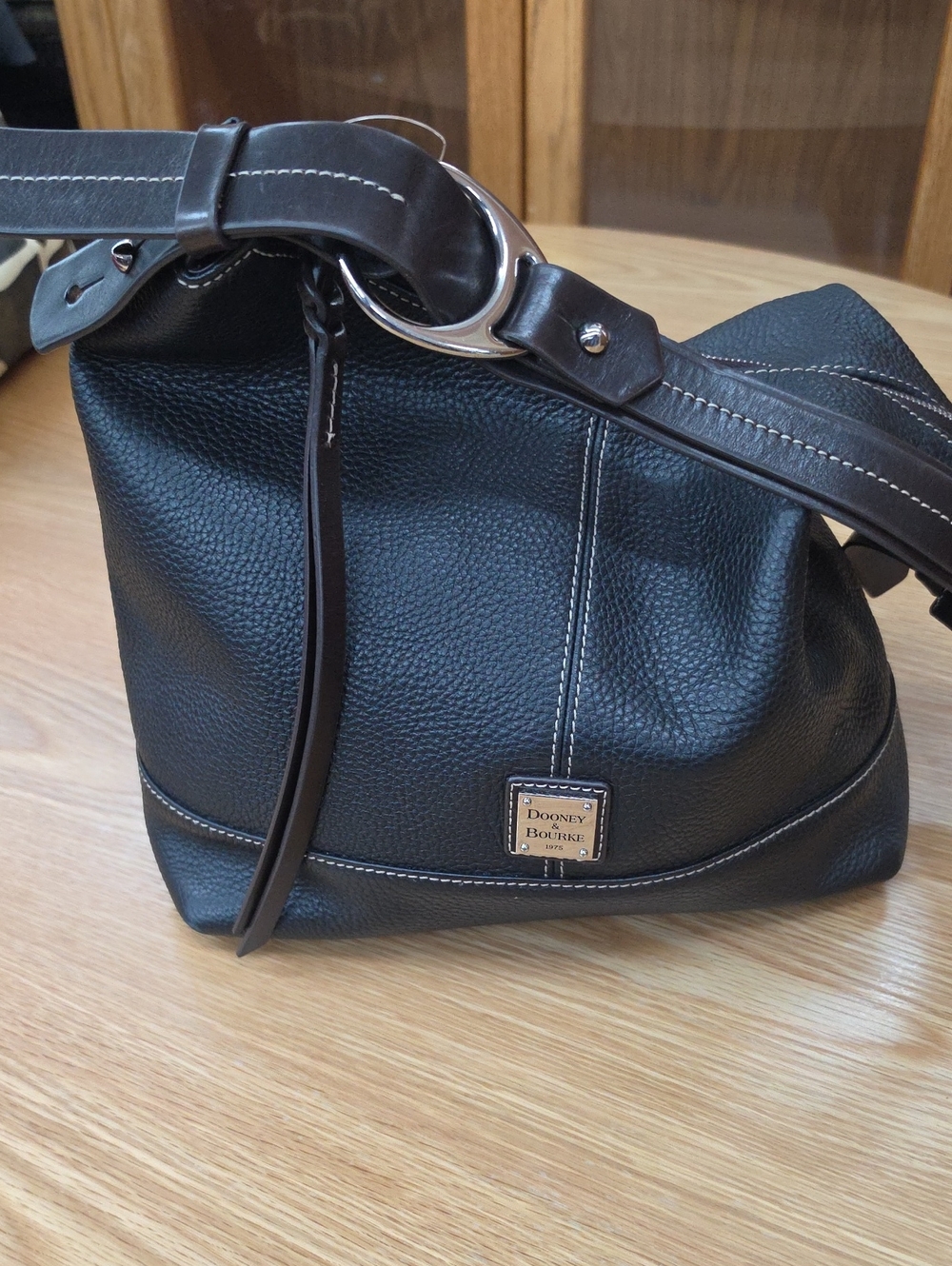 Dooney & Bourke Black Pebbled Leather Shoulder Bag with Contrast Stitching
